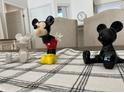 Three Mickey Mouse figurines on a table with a black and white checked tablecloth at 8513 Crystal Cove Loop, Kissimmee, FL 34747