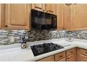 Modern kitchen with gas cooktop and microwave at 971 Worthington Ct, Oviedo, FL 32765