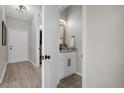 Small half-bathroom with granite vanity and white cabinetry at 100 Napoli Dr, Davenport, FL 33897