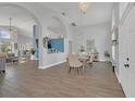 Elegant dining room with hardwood floors and chandelier at 11016 Orangeshire Ct, Ocoee, FL 34761