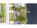 Aerial view of the home and grounds showing the lake front and private dock at 116 Sheridan Ave, Longwood, FL 32750