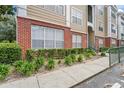 Brick condo building with well-maintained landscaping at 13103 Mulberry Park Dr # 811, Orlando, FL 32821