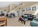 Spacious living room with high ceilings and tiled floors at 1448 Brook Hollow Dr, Orlando, FL 32824