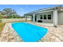 Relaxing rectangular pool with stone deck at 1870 Dumbleton Pl, St Cloud, FL 34771