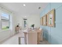 Dining area with light walls and access to the entry and kitchen at 3576 Fort Mellon Ln, Sanford, FL 32773