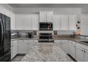 Spacious kitchen with granite countertops and stainless steel appliances at 381 Skyview Pl, Chuluota, FL 32766