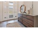 Bright entryway with a modern console table and a large mirror at 400 W Hazel St, Orlando, FL 32804