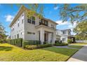 Modern two-story house with a landscaped yard and a spacious driveway at 400 W Hazel St, Orlando, FL 32804