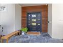 Modern front door with wood paneling and a stone walkway at 400 W Hazel St, Orlando, FL 32804