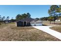 One-story house on a large lot with a two-car garage at 41289 County Road, 452, Leesburg, FL 34788