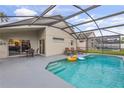 Relaxing pool area with covered patio and lounge chairs at 4705 Pershoie Ln, Kissimmee, FL 34746