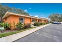 Side view of a condo building showcasing its attractive facade and parking at 4944 Tangerine Ave # 4944, Winter Park, FL 32792