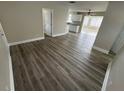 Living room with grey laminate wood flooring at 5822 Forest Grove Blvd, Orlando, FL 32808