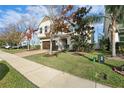 Two-story house with landscaping and brick driveway at 611 Marsh Reed Dr, Winter Garden, FL 34787