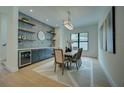 Elegant dining room featuring modern decor, ample natural light, and a stylish bar area for sophisticated gatherings at 809 Maxwell St, Orlando, FL 32804