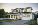 Two-story house with light brick exterior, gray roof, and a two-car garage at 809 Maxwell St, Orlando, FL 32804