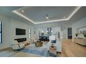 Open-concept living room with hardwood floors, fireplace, and recessed lighting, seamlessly connecting to the modern kitchen at 809 Maxwell St, Orlando, FL 32804