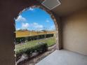 View of backyard with fountain and landscaping at 914 Charo Pkwy # 112, Davenport, FL 33897