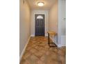 Home entryway with dark gray door and terracotta tile floor at 1354 Tierra Cir, Winter Park, FL 32792