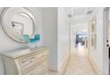 Bright condo entryway with mirror and dresser at 1368 Centre Court Ridge Dr # 104, Reunion, FL 34747