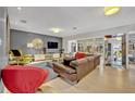 Open-concept living room with hardwood floors and contemporary decor at 1901 Lake Sue Dr, Orlando, FL 32803