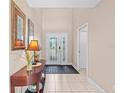 Bright and spacious foyer with tiled floors and a half-wall at 2119 Victoria Dr, Davenport, FL 33837