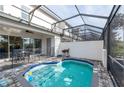 Screened-in pool and patio area with outdoor seating at 236 Captiva Dr, Davenport, FL 33896