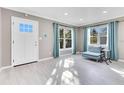 Bright living room featuring light gray walls and tile flooring at 2901 Primrose Ct, Orlando, FL 32803