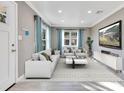 Inviting living room with plush white seating and modern decor, perfect for relaxing and entertaining at 2901 Primrose Ct, Orlando, FL 32803