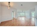 Living room with hardwood floors and access to balcony at 3621 Conroy Rd # 738, Orlando, FL 32839