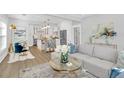 Open concept living space with a modern kitchen and stylish furnishings at 413 W Princeton St, Orlando, FL 32804