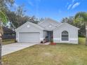 Newly built gray house with a two-car garage at 604 Elfrida Way, Kissimmee, FL 34758
