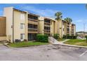 Exterior view of a condo building showcasing its light-colored facade and balconies at 620 Orange Dr # 228, Altamonte Springs, FL 32701