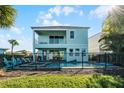Back view of house, showcasing pool and patio at 8137 Surf St, Kissimmee, FL 34747