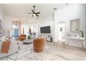 Bright and airy living room with hardwood floors and modern furnishings at 10050 Hidden Dunes Ln, Orlando, FL 32832
