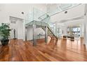 Bright and spacious entryway with modern staircase and hardwood floors at 11618 Vinci Dr, Windermere, FL 34786