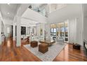 Open concept living space with hardwood floors and water views at 11618 Vinci Dr, Windermere, FL 34786