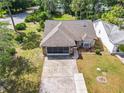 Single Gathering home with driveway and landscaped yard at 120 Crooked Pine Rd, Port Orange, FL 32128