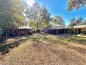 Large backyard with a shed and covered patio at 12151 Se 86Th Ave, Belleview, FL 34420