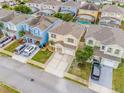 Aerial view of houses with pools and driveways at 1266 Sandestin Way, Orlando, FL 32824