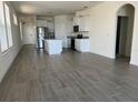 Open concept kitchen with granite countertops and stainless steel appliances at 16704 Point Rock Dr, Winter Garden, FL 34787