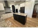 Spacious kitchen with modern appliances, island, beautiful countertops and ample cabinet space at 205 Hazard St, Orlando, FL 32804