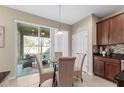 Bright breakfast nook with neutral tones and sliding doors leading to an outdoor patio at 2874 Pewter Mist Ct, Oviedo, FL 32765