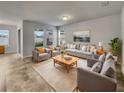 Bright living room featuring comfy seating and large windows at 2943 Top Water Way, Kissimmee, FL 34746