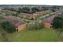 Aerial view of a neighborhood with multiple townhouses at 3428 Calabria Ave, Davenport, FL 33897