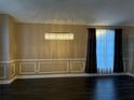 Spacious dining area with dark hardwood floors and a crystal chandelier at 371 Lexingdale Dr, Orlando, FL 32828