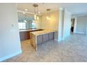 Modern kitchen featuring granite countertops and custom cabinetry at 7580 Toscana Blvd # 834, Orlando, FL 32819