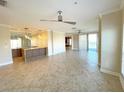 Open living space with tile floors and a breakfast bar at 7580 Toscana Blvd # 834, Orlando, FL 32819