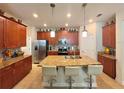 Island kitchen with granite countertops and stainless steel appliances at 1506 Bunker Dr, Davenport, FL 33896