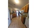 Spacious kitchen with granite countertops and wooden cabinets at 212 Ashford Dr, Davenport, FL 33837